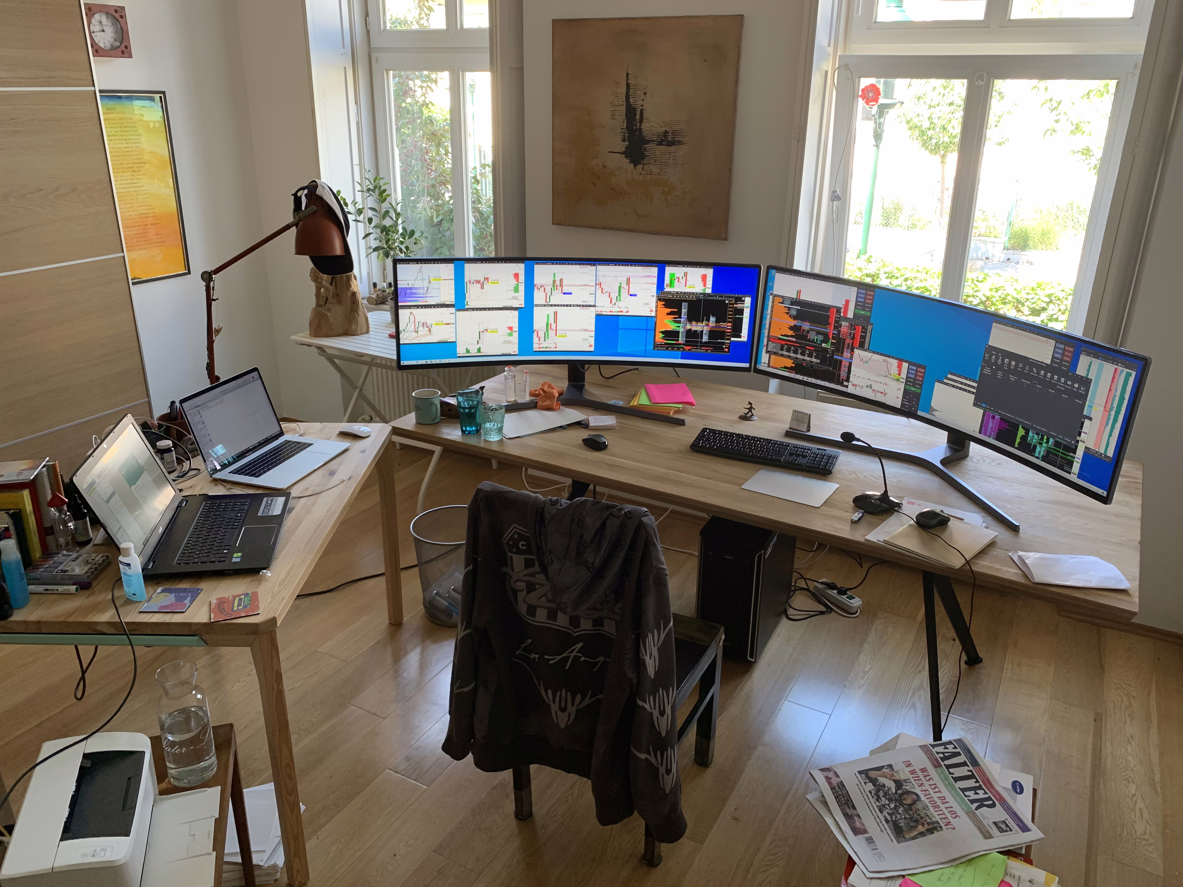 Modern office space with glowing digital charts displayed across multiple screens.